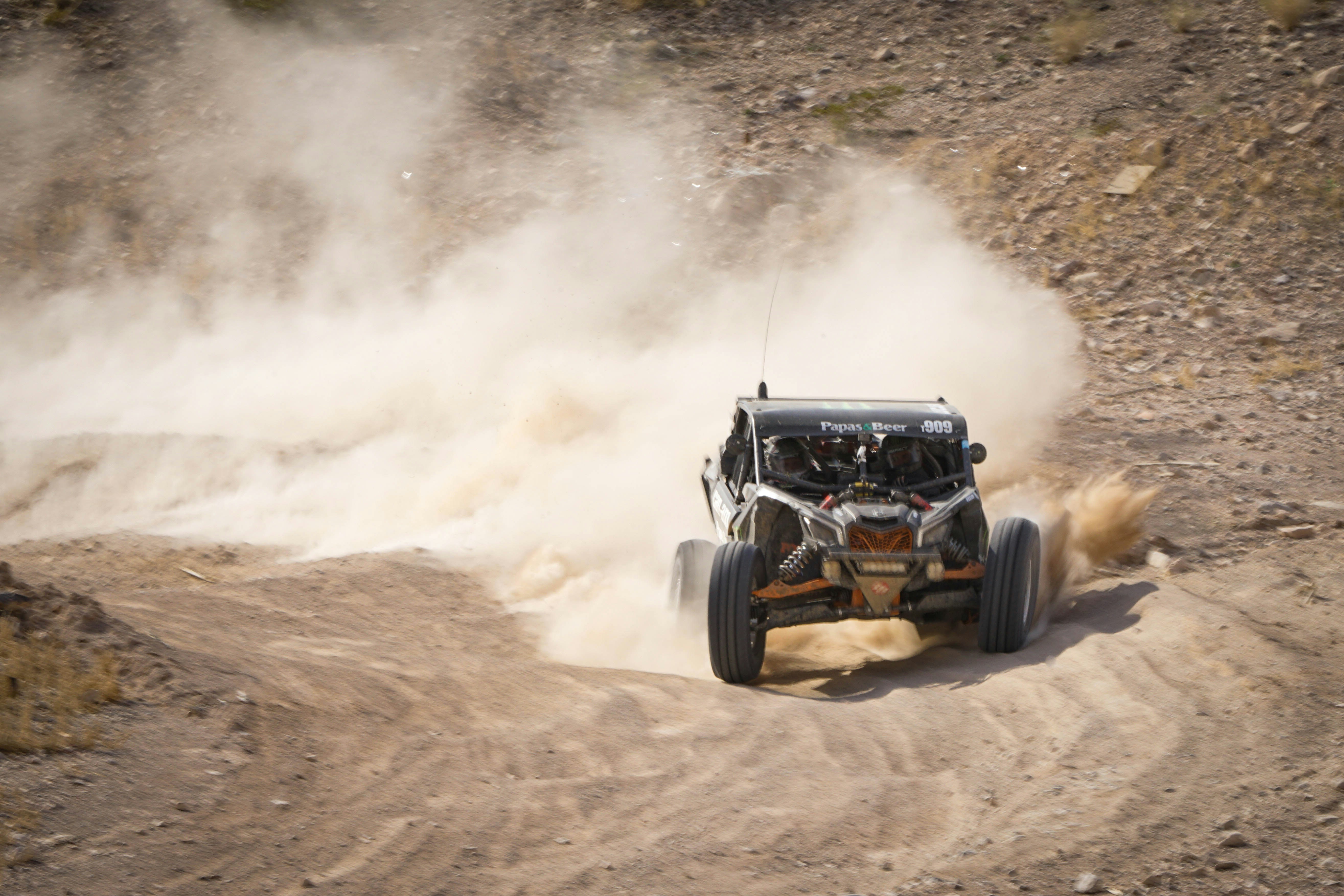 Buggy driving through sand dunes