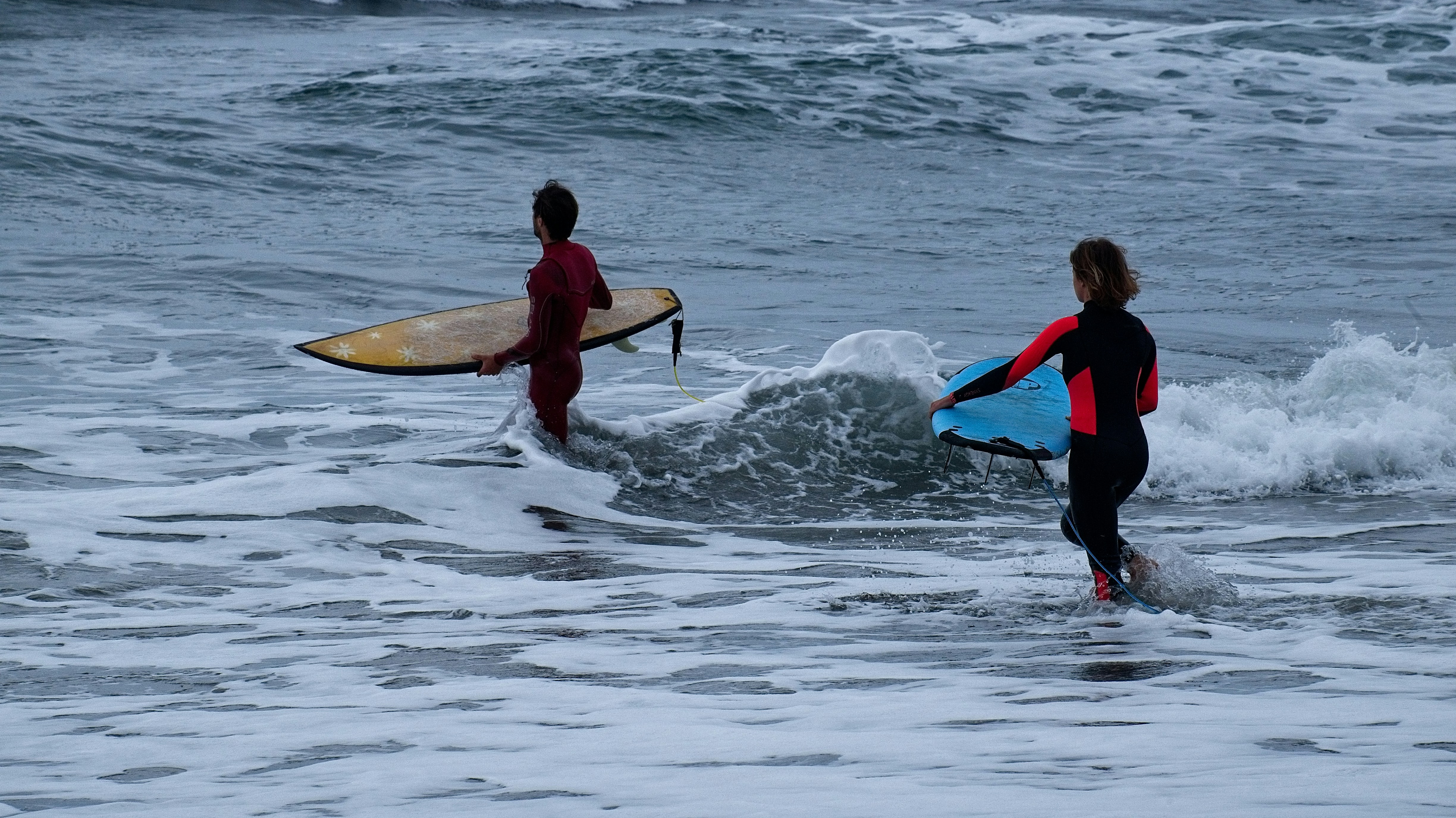 Person learning to surf in Taghazout waves